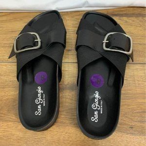 Woman’s leather slides. Black with silver buckle. Size 8.5. New with tags. Made